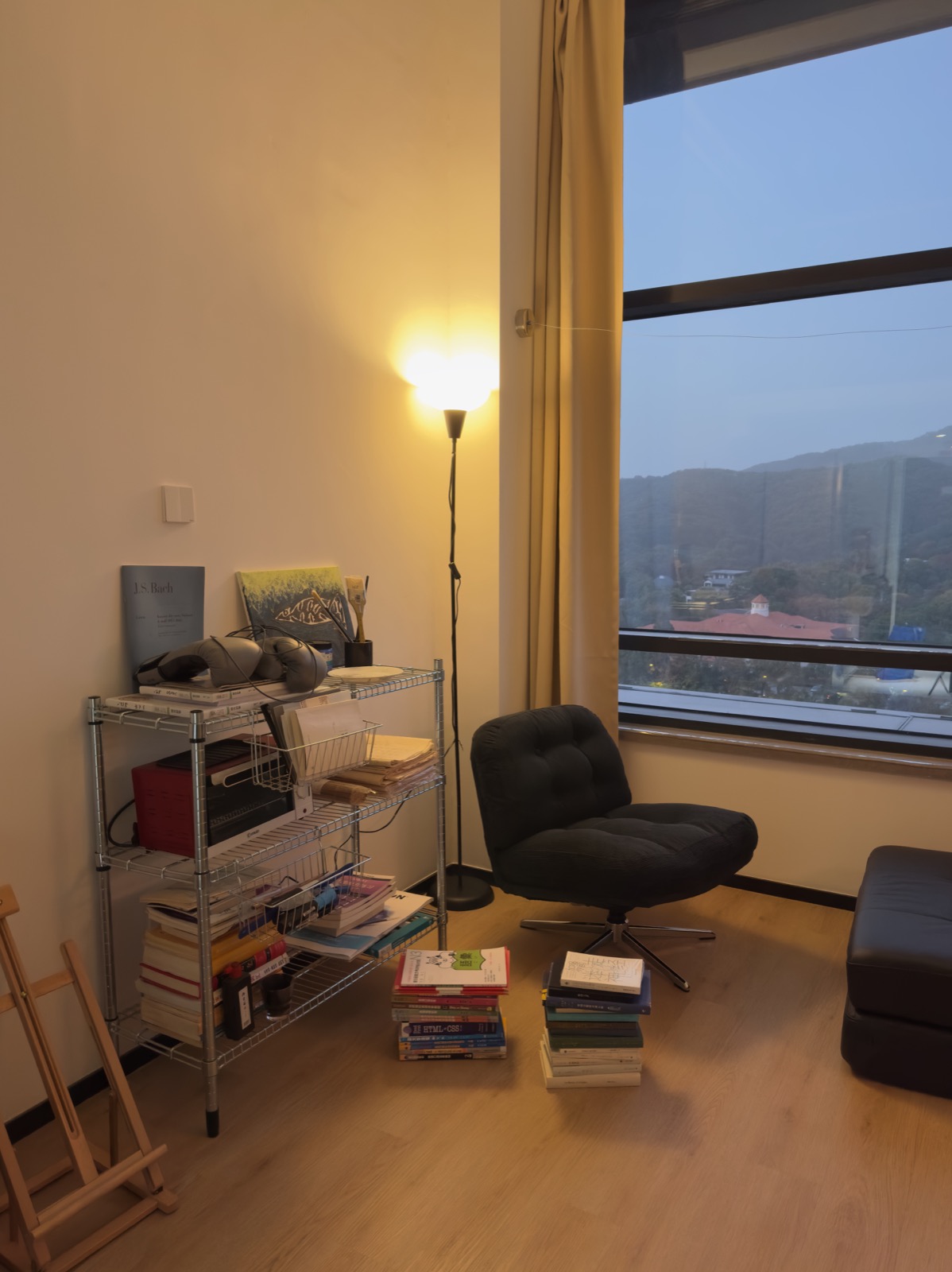 Warm lamplight and an evening mountain view — photographed by Ooud